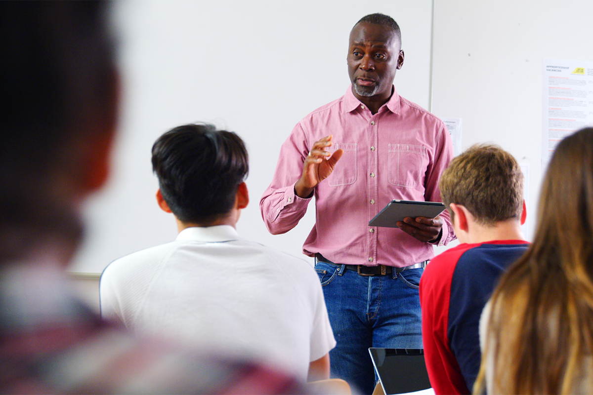 Teacher giving lecture in classroom