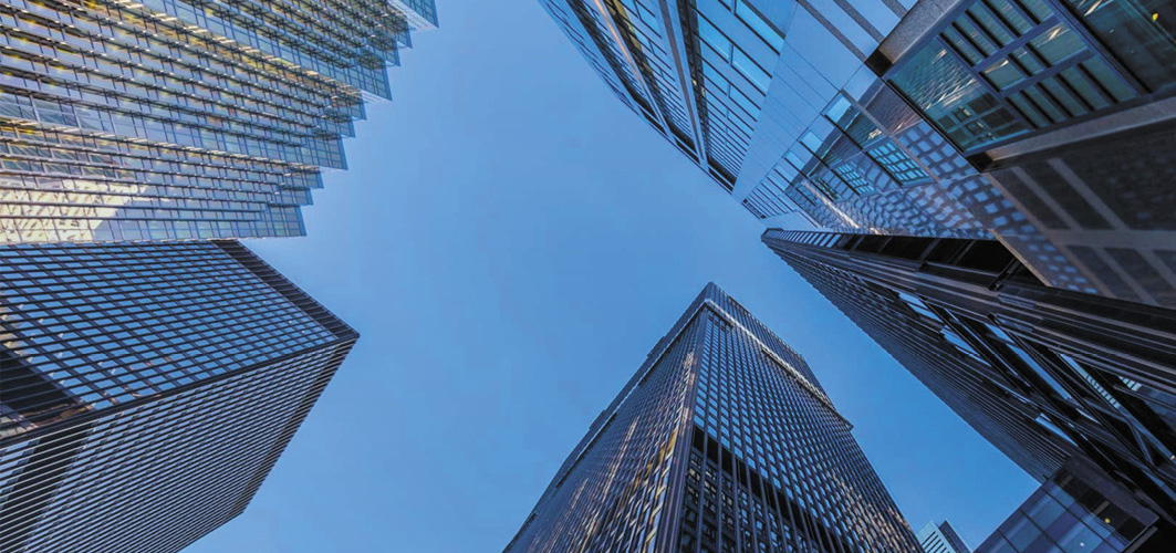 View of high rise buildings, looking up from street level.