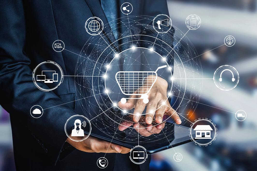 Man on ipad, with overlayed image of ecommerce icons