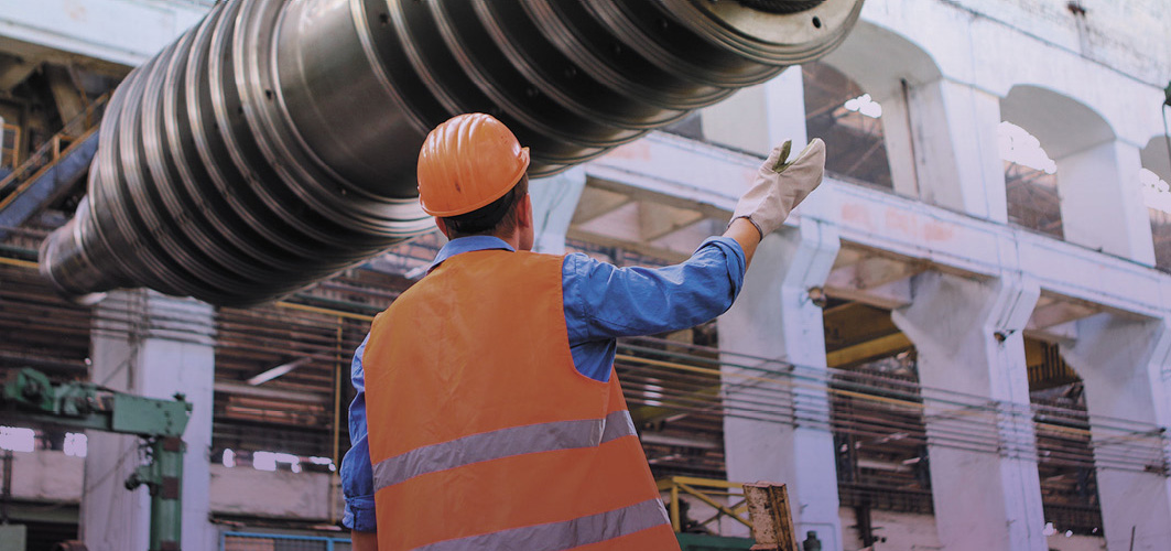Man in high vis and hard hat on a building site 