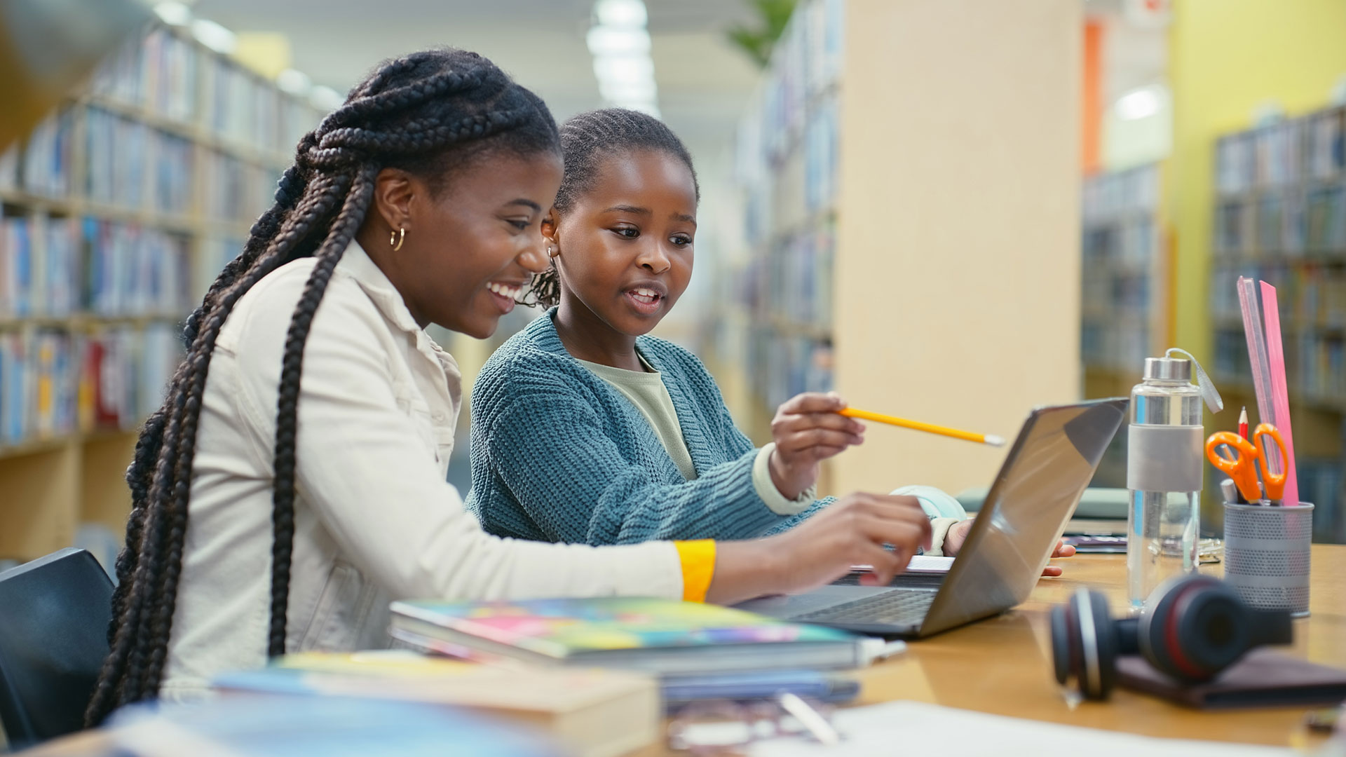 Teacher, girl and laptop for e learning in library