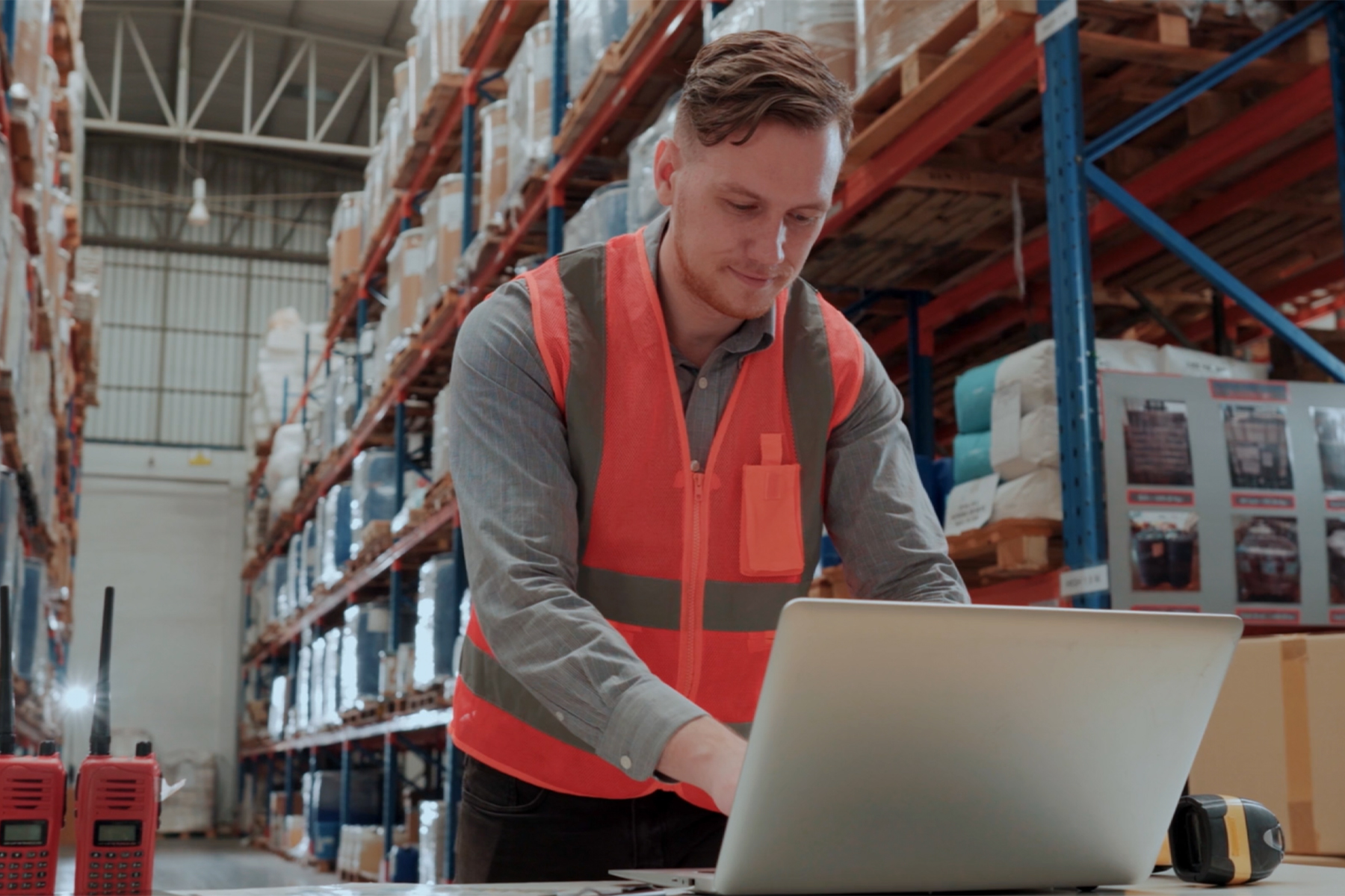 Man at computer in storage warehouse