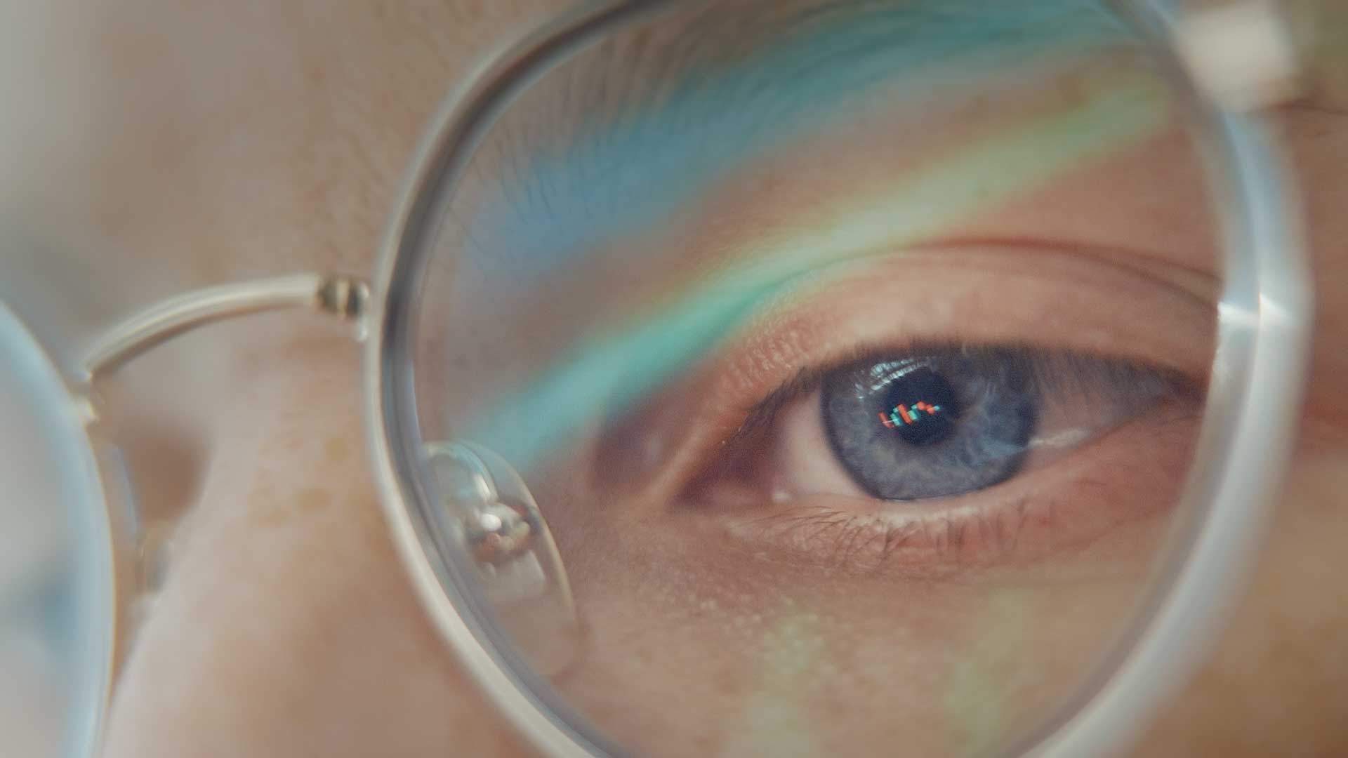 Close up of persons eye wearing glasses