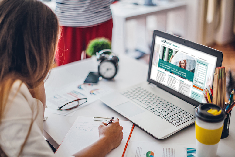 Young woman office worker in her office working on laptopYoung woman office worker in her office working on laptop