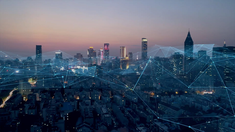 Abstract image of night time city skyline, overlaid with network of digital connections