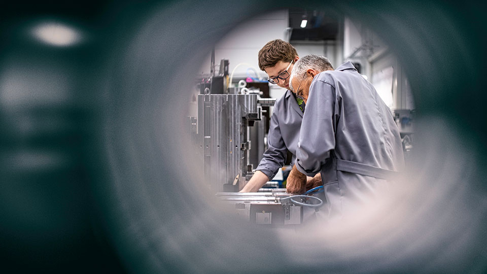 Engineers fixing a machine